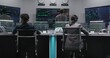© Framestock - Multi ethnic team of traders work on multi-monitor computers with displayed real-time stocks. Colleagues analyze exchange market charts on big screens. Cryptocurrency trading and investment. Zoom out.
