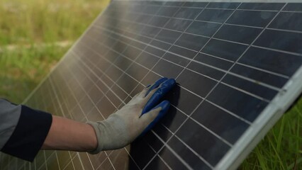 Wall Mural - Engineer hand is installing and checking an operation of sun and cleanliness of photovoltaic solar panels, Engineer with energy measurement tool photovoltaic modules for renewable energy