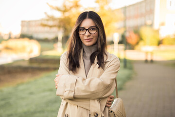 Beautiful LGTB student woman 20s with glasses in the street confidently and profoundly looking towards the camera