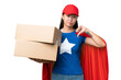 © luismolinero - Super Hero delivery Asian woman holding boxes over isolated background showing thumb down with negative expression