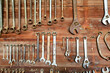 © Austockphoto - Rust speckled tools hanging neatly in place on farm shed wall