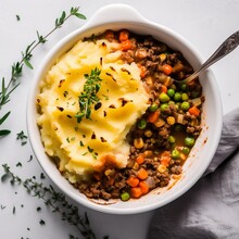 View From The Top Vegan Shepperds Pie With Delicious Healhty Vegetables And Mashed Potatoes With A Spoon And Garnish