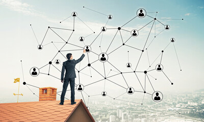 Wall Mural - businessman on house roof presenting networking and connection c
