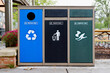 Recycle, waste, and compost bins in a public place.