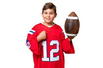 Wall Mural - Little caucasian kid playing rugby over isolated chroma key background with surprise facial expression