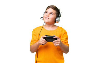 Wall Mural - Little caucasian kid playing with a video game controller over isolated chroma key background thinking an idea while looking up