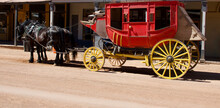 Pair Of Horses Harnessed To A Vintage Stagecoach