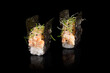 Gunkan maki sushi with tiger prawn on black background