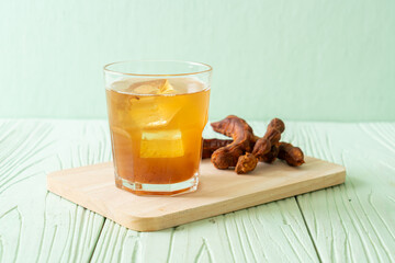 Poster - Delicious sweet drink tamarind juice and ice cube