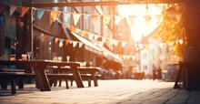 City Street With Garlands Of Lights, White Blue Holiday Flags, Blank Bokeh Background. Concept Of Autumn, Oktoberfest
