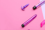 Fototapeta  - Vibrators with anal plugs on color background