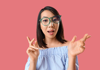 Wall Mural - Beautiful Asian woman in stylish eyeglasses on pink background