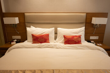 Comfortable bed in hotel bedroom. Conceptual shot of a place for someone to stay, live, or work temporary.