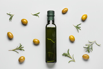 Bottle of olive oil on grey background