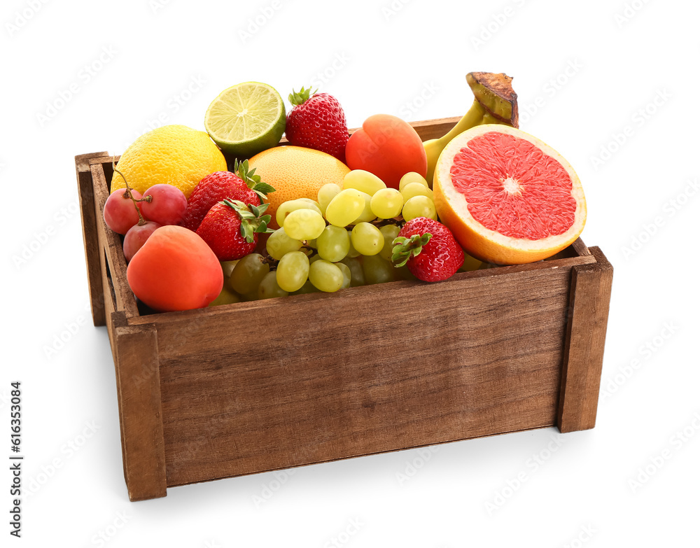 Wooden box with different fresh fruits on white background