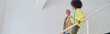 © Friends Stock - African-American woman with smiling mature colleague fashion des