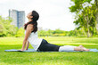 © FotoArtist - Pleasant millennial woman practice yoga outdoor in the morning during wellness retreat.