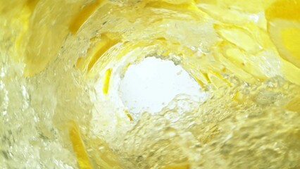 Poster - Super Slow Motion of Water Wave with Lemon Slices. Water Surf Wave Rotating Around in Creating Tunnel Shape. Filmed on high speed cinema camera, 1000 fps.