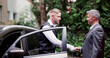 © Andrey Popov - Man Giving Car Key To Male Valet