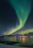 Fototapeta Tęcza - Aurora borealis over the Lyngen Alps in Arctic Norway
