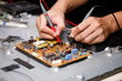 © Teerapong23 - Electronics technician, electronic engineering electronic repair,electronics measuring and testing, repair and maintenance concepts.