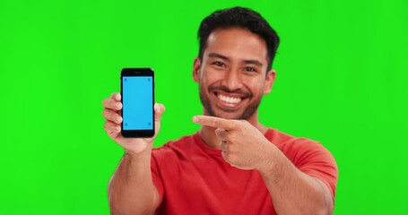 Poster - Man, face and pointing at phone by green screen with smile, review and choice with mockup space for app logo. Student guy, smartphone and happy for decision for branding, promotion or studio portrait