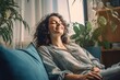 © Banana Images - Happy woman relaxing on the sofa at home - Smiling girl enjoying day off lying on the couch, Healthy life style, good vibes people and new home concept