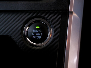 Engine start button, modern car start and stop button.