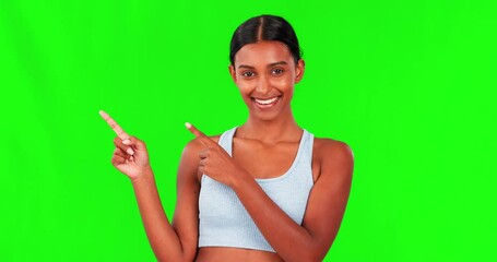 Wall Mural - Happy woman, fitness and pointing on green screen for advertising against a studio background. Portrait of fit, active and sporty female person with smile in advertisement or show on mockup space