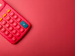 Top view red calculator on a red background