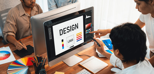 Aufkleber - Graphic designer work on computer laptop and with graphic drawing pen while brainstorming unique design with professional graphic team in modern digital studio workplace. Panorama shot. Scrutinize