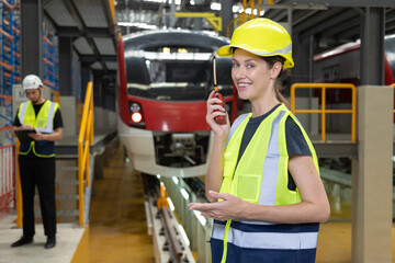 Wall Mural - Portrait of Engineer train Inspect the Railway Electrification System track in depot of train