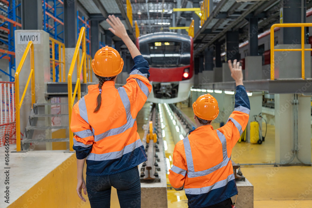 Two professional engineers checkmechanical check undercarriage of ...