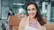 © M Stocker - Close up smiling face of young passenger hispanic latin women sitting in terminal gate at airport while waitting airplane flight looking at camera. Travel concept