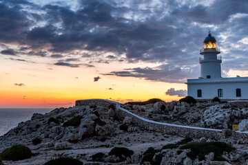 Wall Mural - Landscape of a beautiful sunset at Cavallerie Lighthouse. Menorca, Spain