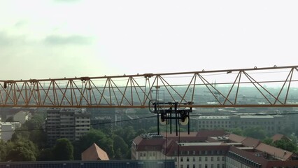 Wall Mural - close-up of a a Tower crane moving on a construction site