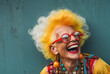 © Nedrofly - Photo of a happy elder woman with vibrant orange hair and stylish sunglasses
