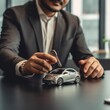 © customer solution - car dealer hand holding key with using calculator. concept car insurance and financing