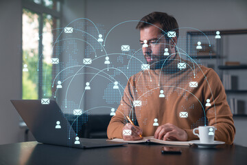 Wall Mural - thoughtful businessman in casual wear typing on laptop at office workplace. concept of distant work,
