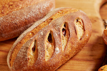 Wall Mural - Assorted bread on a wooden plate