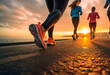 canvas print picture - Laufgruppe am Ufer: Beine von Sportlern im Fokus bei morgendlichem Lauf am Strand