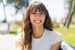 © luismolinero - Young woman at outdoors With glasses and happy expression