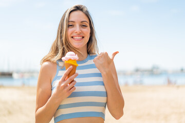 Sticker - Young pretty woman with a cornet ice cream at outdoors pointing to the side to present a product