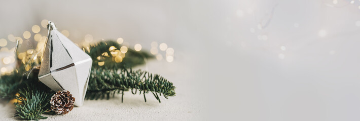 Empty white wold table top with abstract warm living room decor with christmas tree string light blur background with snow,Holiday backdrop,Mock up banner for display of advertise product