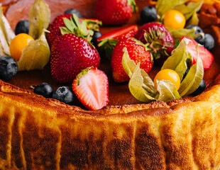 Wall Mural - San Sebastian cheesecake with berries close up