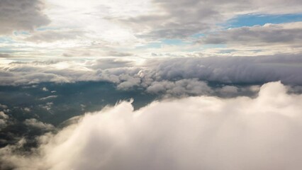 Wall Mural - 4k motion time lapse video aerial view morning scenery mist flowing over the high mountains the move