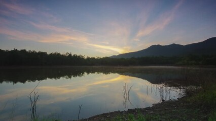 Wall Mural - morning view of the misty reservoir at the top of the water, surrounded by mountains. beautiful sky.