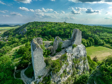 Aerial panoramic view of Sirotčí hrádek or Waisenstein ruined Gothic castle above Klentnice in South Moravia standing on two limestone cliffs 