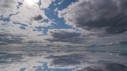 Wall Mural - Water surface in Ultra HD 4K, Loop Footage - View against the sky. sky with evening sky clouds over the sea. Small smooth waves and water reflection