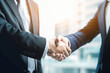 © julijadmi - Two business people shaking hands to agree to joint business agreements. Generative AI.